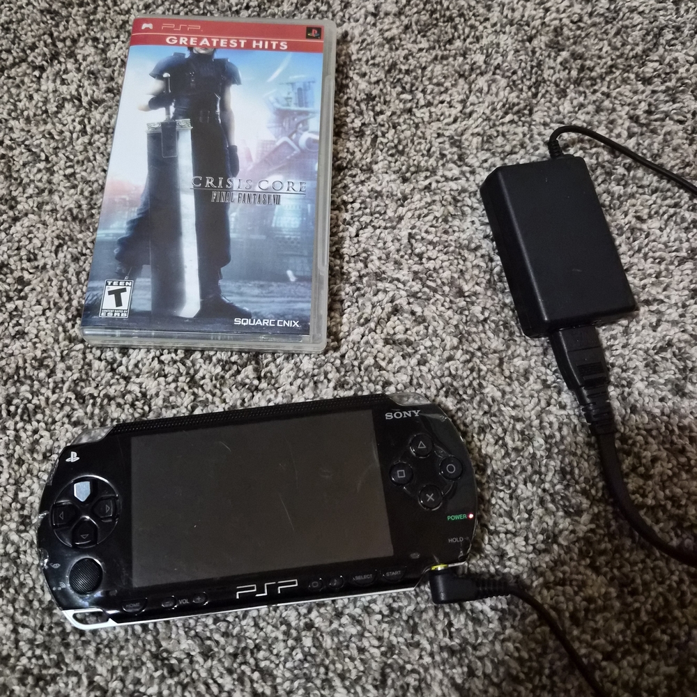 Two Sony PSP Handheld Consoles with Crisis Core